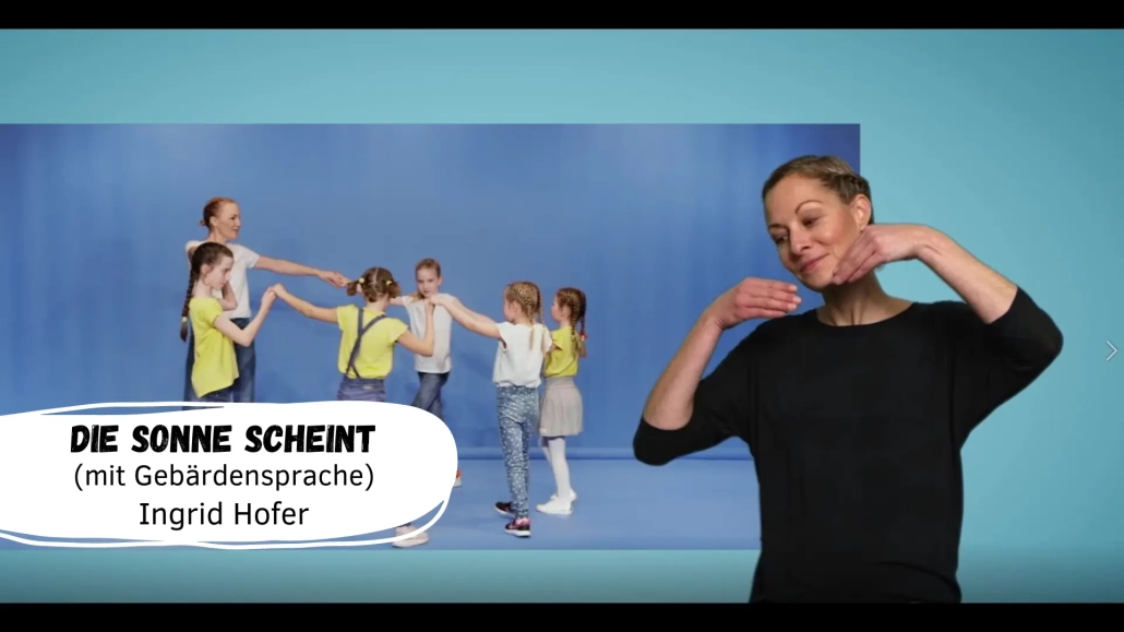 Kinder tanzen und lernen Gebärdensprache.